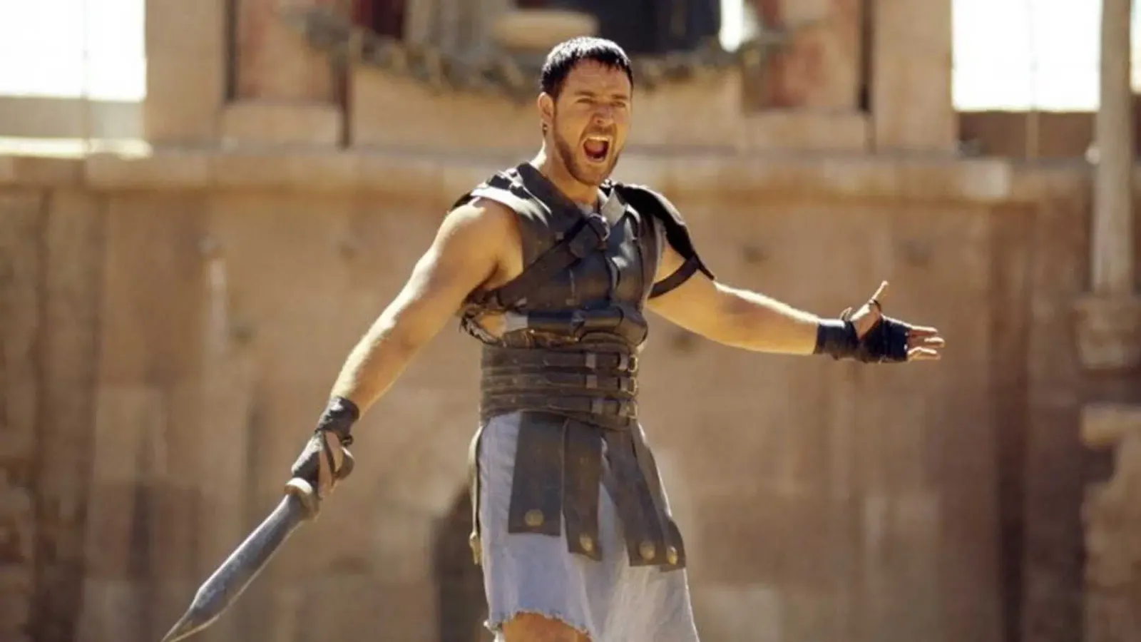 A gladiator holds a sword and yells