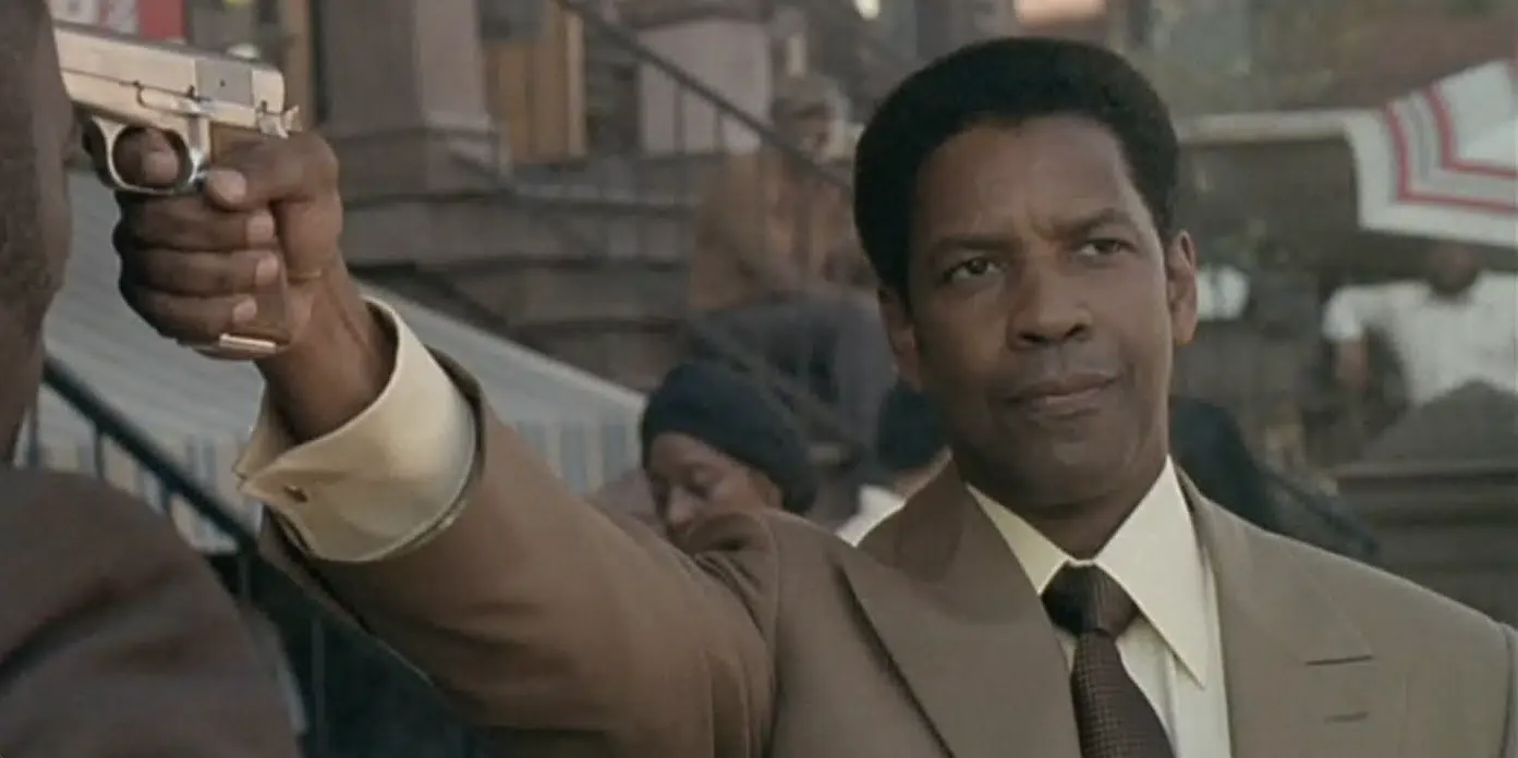 a man points a handgun off screen