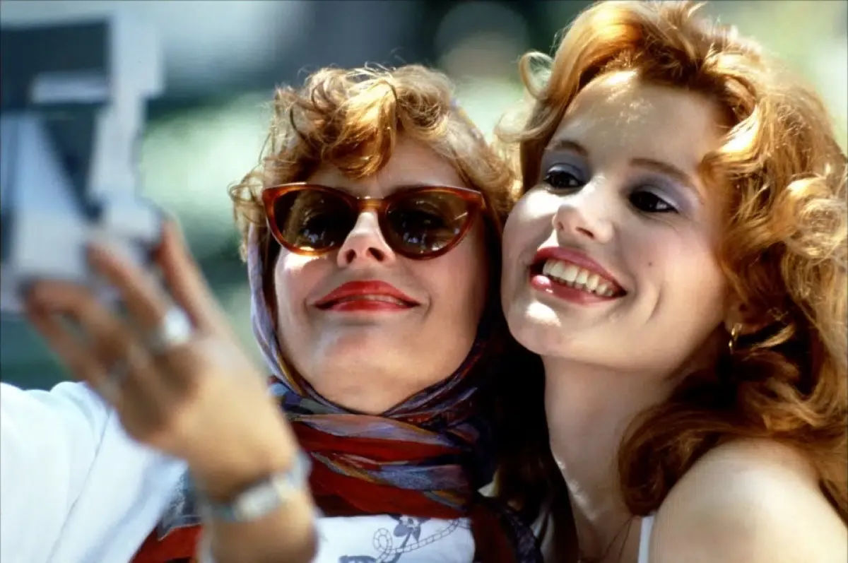 two women pose for a selfie