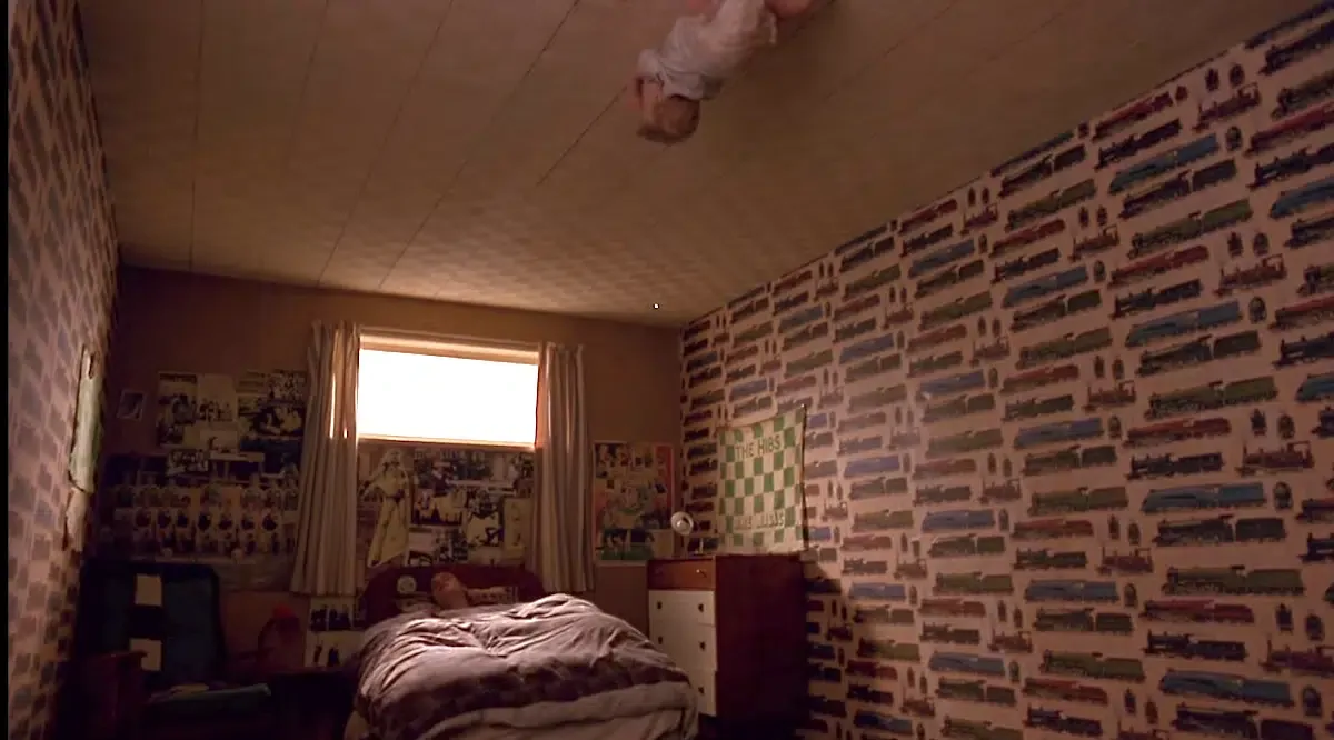 In Trainspotting (1996), there is a scene where we see a baby crawling on the roof. This suggests that the baby was probably related to Spider-Man. We don't see the "Spiderbaby" again,
